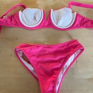 Brand new with tags hot pink bikini top is size small, bottoms are size medium